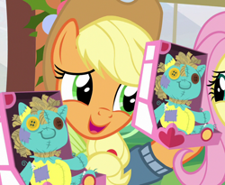 Size: 878x720 | Tagged: safe, screencap, character:applejack, species:pony, episode:best gift ever, g4, my little pony: friendship is magic, cropped, female, holly the hearths warmer doll, mare, solo focus, yay