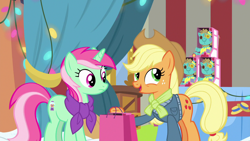 Size: 1280x720 | Tagged: safe, screencap, character:applejack, character:minty bubblegum, species:earth pony, species:pony, species:unicorn, episode:best gift ever, g4, my little pony: friendship is magic, bag, clothing, duo, female, holly the hearths warmer doll, jacket, mare, scarf