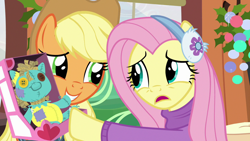 Size: 1280x720 | Tagged: safe, screencap, character:applejack, character:fluttershy, species:pony, episode:best gift ever, g4, my little pony: friendship is magic, clothing, earmuffs, friendship express, holly the hearths warmer doll, pushing, sweater, sweatershy