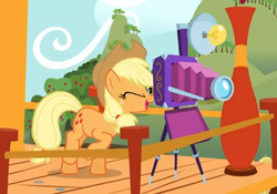 Size: 464x324 | Tagged: safe, screencap, character:applejack, species:earth pony, species:pony, episode:apple family reunion, g4, my little pony: friendship is magic, camera, cropped, female, mare, raised hoof, solo