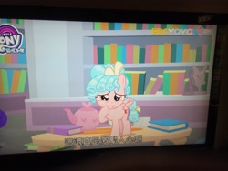 Size: 4160x3120 | Tagged: safe, screencap, character:cozy glow, species:pegasus, species:pony, episode:what lies beneath, g4, my little pony: friendship is magic, book, bookshelf, female, filly, irl, photo, solo, subtitles, teapot, yoyotv