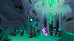 Size: 1440x809 | Tagged: safe, screencap, character:queen chrysalis, character:starlight glimmer, character:thorax, species:changeling, species:pony, species:unicorn, episode:to where and back again, g4, my little pony: friendship is magic, armor, changeling guard, changeling hive, changeling queen, changeling slime, cocoon, disguise, disguised changeling, fake starlight glimmer, female, helmet, mare