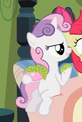 Size: 497x745 | Tagged: safe, screencap, character:apple bloom, character:sweetie belle, species:earth pony, species:pony, species:unicorn, episode:family appreciation day, g4, my little pony: friendship is magic, bed, bowl, cropped, evil grin, female, filly, food, grapes, grin, offscreen character, sitting, smiling, solo focus
