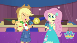 Size: 1920x1080 | Tagged: safe, screencap, character:applejack, character:fluttershy, episode:best in show: the victory lap, g4, my little pony:equestria girls, geode of fauna, geode of super strength, looking at you, magical geodes, microphone