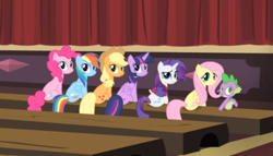 Size: 693x396 | Tagged: safe, screencap, character:applejack, character:fluttershy, character:pinkie pie, character:rainbow dash, character:rarity, character:spike, character:twilight sparkle, character:twilight sparkle (alicorn), species:alicorn, species:earth pony, species:pegasus, species:pony, species:unicorn, episode:rarity takes manehattan, g4, my little pony: friendship is magic, cropped, female, looking back, mane seven, mane six, mare, rear view, sitting, smiling, theater