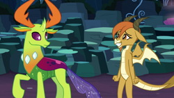 Size: 1920x1080 | Tagged: safe, screencap, character:ocellus, character:thorax, species:changedling, species:changeling, species:dragon, species:reformed changeling, episode:uprooted, g4, my little pony: friendship is magic, changeling king, cute, diaocelles, disguise, disguised changeling, dragon ocellus, dragonellus, dragoness, duo, female, looking back, male, raised hoof, sheepish grin
