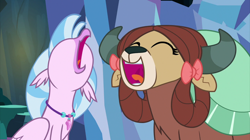 Size: 2100x1179 | Tagged: safe, screencap, character:silverstream, character:yona, species:hippogriff, species:yak, episode:uprooted, g4, my little pony: friendship is magic, bow, duo, eyes closed, faec, female, hair bow, open beak, open mouth, singing, the place where we belong