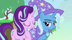 Size: 1280x720 | Tagged: safe, screencap, character:starlight glimmer, character:trixie, species:pony, species:unicorn, episode:to change a changeling, g4, my little pony: friendship is magic, cape, changeling kingdom, clothing, eyes closed, female, frown, hat, mare, raised eyebrow, raised hoof, smiling, trixie is not amused, trixie's cape, trixie's hat, unamused