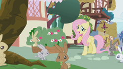 Size: 1280x720 | Tagged: safe, screencap, character:fluttershy, species:pegasus, species:pony, species:rabbit, episode:applebuck season, g4, my little pony: friendship is magic, animal, eating, female, mare, ponyville, raised hoof