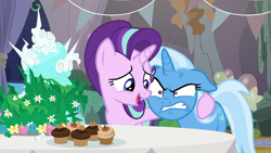 Size: 1920x1080 | Tagged: safe, screencap, character:starlight glimmer, character:trixie, species:pony, species:unicorn, episode:student counsel, angry, cake, cross-popping veins, cupcake, duo, equinox cake, female, floppy ears, food, mare, side hug