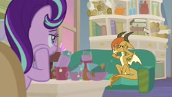 Size: 1920x1080 | Tagged: safe, screencap, character:ocellus, character:starlight glimmer, species:changedling, species:dragon, species:pony, species:unicorn, episode:student counsel, book, bookshelf, chair, couch, cup, desk, disguise, disguised changeling, dragon ocellus, dragonellus, duo, female, mug, school of friendship, sitting, starlight's office, teacup, teapot