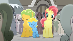 Size: 1366x768 | Tagged: safe, screencap, species:earth pony, species:pegasus, species:pony, species:unicorn, friendship is magic: rainbow roadtrip, g4, my little pony: friendship is magic, background pony, building, colored, colt, crowd, cute, dawn droplet, desaturated, discovery family logo, family, father and son, female, flower, flower in hair, grayscale, happy, jasmine breeze, like father like son, male, mare, monochrome, mother and son, raised hoof, rich harvest, sideburns, stallion, thick eyebrows, unnamed pony