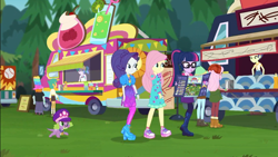 Size: 1920x1080 | Tagged: safe, screencap, character:fluttershy, character:rarity, character:snails, character:snips, character:spike, character:spike (dog), character:twilight sparkle, character:twilight sparkle (scitwi), species:dog, species:eqg human, episode:lost and pound, g4, my little pony:equestria girls, background human, boots, brochure, clothing, female, food truck, glasses, hat, high heels, male, music festival outfit, outdoors, peppermint azure, ponytail, raspberry lilac, shoes, sneakers, snips's festival hat, spike's festival hat, summer solstice (character), vendor