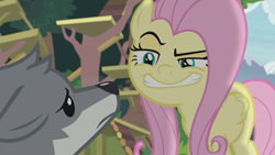 Size: 1920x1080 | Tagged: safe, screencap, character:angel bunny, character:fluttershy, species:pegasus, species:pony, species:wolf, episode:she talks to angel, g4, my little pony: friendship is magic, evil grin, eyebrows, faec, female, grin, mare, raised eyebrow, raised eyebrows, sandra, smiling, smug, worried