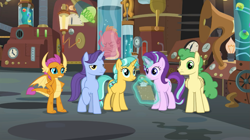 Size: 1087x607 | Tagged: safe, screencap, character:citrine spark, character:fire quacker, character:huckleberry, character:november rain, character:smolder, character:starlight glimmer, species:dragon, species:pegasus, species:pony, species:unicorn, episode:a horse shoe-in, g4, my little pony: friendship is magic, claws, clipboard, doctor whooves' lab, dragoness, female, flameless fireworks, friendship student, glowing horn, horn, horns, laboratory, magic, magic aura, mare, octopus, pencil, raised eyebrow, raised hoof, specimens, spread wings, squirk, students, teenager, telekinesis, wings, young