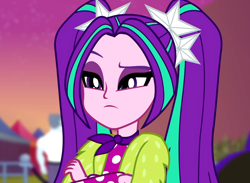 Size: 1476x1080 | Tagged: safe, screencap, character:aria blaze, equestria girls:sunset's backstage pass, g4, my little pony:equestria girls, ascot, background human, cropped, crossed arms, female, male, max steele, pigtails, raised eyebrow, security guard, solo, twintails, unimpressed