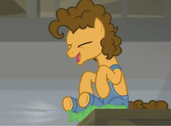 Size: 1048x772 | Tagged: safe, screencap, character:cheese sandwich, species:pony, episode:the last laugh, g4, my little pony: friendship is magic, dungarees, factory, gag factory, overalls, sitting, solo, whoopee cushion