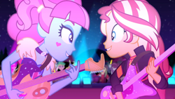 Size: 1916x1080 | Tagged: safe, screencap, character:curly winds, character:kiwi lollipop, character:sandalwood, character:sunset shimmer, equestria girls:sunset's backstage pass, g4, my little pony:equestria girls, background human, concert, curly winds, duo, duo female, electric guitar, female, glowstick, guitar, k-lo, kiwi lollipop, lemon zack, looking at each other, male, musical instrument, some blue guy, track starr, true original (song)