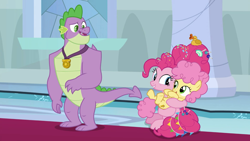 Size: 1920x1080 | Tagged: safe, screencap, character:li'l cheese, character:pinkie pie, character:spike, species:dragon, species:earth pony, species:pony, episode:the last problem, g4, my little pony: friendship is magic, all is well, candy, claws, female, folded wings, food, gigachad spike, grin, holding, like mother like child, lollipop, looking at each other, male, mare, mother, older, older pinkie pie, older spike, poofy mane, raised eyebrow, rubber duck, smiling, sprinkles, throne room, winged spike, wings