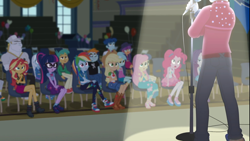 Size: 1918x1078 | Tagged: safe, screencap, character:applejack, character:bulk biceps, character:curly winds, character:flash sentry, character:fluttershy, character:ginger owlseye, character:lyra heartstrings, character:pinkie pie, character:rainbow dash, character:rarity, character:snails, character:snips, character:sunset shimmer, character:trixie, character:twilight sparkle, character:twilight sparkle (scitwi), species:eqg human, episode:cheer you on, g4, my little pony:equestria girls, background human, balloon, bleachers, canterlot high, converse, crossed legs, crowd, curly winds, geode of empathy, geode of sugar bombs, geode of super speed, geode of super strength, geode of telekinesis, gym, humane five, humane seven, humane six, legs, magical geodes, microphone, microphone stand, ponytail, shoes, singing, some blue guy, spotlight