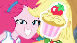 Size: 1920x1080 | Tagged: safe, screencap, character:applejack, character:pinkie pie, episode:do it for the ponygram!, g4, my little pony:equestria girls, cupcake, cute, diapinkes, duo, duo female, female, food, frosting, geode of sugar bombs, geode of super strength, grin, magic cupcake touch, magical geodes, smiling, strawberry coconut cupcake