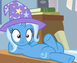 Size: 1189x980 | Tagged: safe, screencap, character:trixie, species:pony, species:unicorn, episode:a horse shoe-in, g4, my little pony: friendship is magic, anatomically incorrect, classroom, clothing, cropped, crossed legs, desk, discovery family logo, female, hat, incorrect leg anatomy, interrupted, mare, on back, reclining, shrunken pupils, solo, surprised, trixie's hat, wide eyes