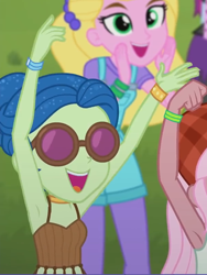 Size: 606x808 | Tagged: safe, screencap, character:mystery mint, episode:accountibilibuddies, g4, my little pony:equestria girls, armpits, arms in the air, clothing, cropped, female, halter top, hands in the air, laurel jade, midriff, offscreen character, overall shorts, overalls, raised arm, raised hand, raspberry lilac, sandy cerise, shorts, sleeveless, smiling, sunglasses