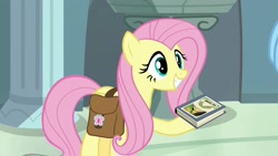 Size: 1920x1080 | Tagged: safe, screencap, character:fluttershy, species:pegasus, species:pony, episode:daring doubt, g4, my little pony: friendship is magic, betrayal, cute, daring do and the fallen idol, daring do book, folded wings, grin, rainbow dash's house, saddle bag, smiling, traitor, wings