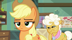 Size: 1280x720 | Tagged: safe, screencap, character:applejack, character:goldie delicious, species:pony, episode:going to seed, g4, my little pony: friendship is magic, duo, frown, lidded eyes
