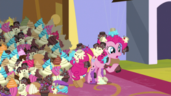 Size: 1920x1080 | Tagged: safe, screencap, character:pinkie pie, species:earth pony, species:pony, episode:the ending of the end, g4, my little pony: friendship is magic, canterlot, cupcake, female, food, frosting, mare, messy, raised hoof, solo, sprinkles