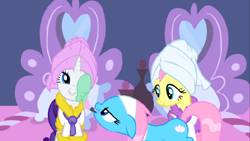 Size: 1136x640 | Tagged: safe, screencap, character:aloe, character:fluttershy, character:lotus blossom, character:rarity, species:earth pony, species:pegasus, species:pony, species:unicorn, episode:green isn't your color, g4, my little pony: friendship is magic, applying, bathrobe, clothing, female, floppy ears, mare, mud mask, robe, smiling, spa, towel on head
