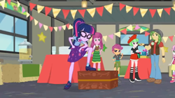 Size: 1600x900 | Tagged: safe, screencap, character:cheerilee, character:sandalwood, character:scootaloo, character:sweetie belle, character:twilight sparkle, character:twilight sparkle (scitwi), character:watermelody, species:eqg human, species:pegasus, species:pony, equestria girls:holidays unwrapped, g4, my little pony:equestria girls, banner, beret, boots, bow tie, cardboard cutout, chest, clothing, container, decoy, dispenser, eyes closed, gift box, glasses, hat, hay bale, high heel boots, lantern, miniskirt, pocket, ponytail, shoes, shorts, skirt, socks, table, window