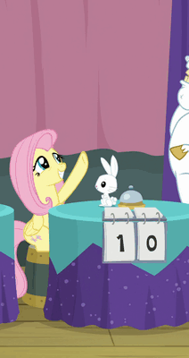 Size: 212x400 | Tagged: safe, screencap, character:angel bunny, character:bulk biceps, character:fluttershy, species:pegasus, species:pony, species:rabbit, episode:a trivial pursuit, g4, my little pony: friendship is magic, animal, animated, bell, cropped, female, gif, hoofbump, male, mare, oops, ouch, smiling, table, yeah!!!!!!!!