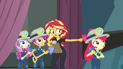Size: 1920x1080 | Tagged: safe, screencap, character:apple bloom, character:scootaloo, character:sunset shimmer, character:sweetie belle, species:pegasus, species:pony, episode:all the world's off stage, g4, my little pony:equestria girls, apple bloom's bow, bow, clipboard, clothing, cutie mark crusaders, director, director shimmer, female, hair bow, headset, helmet, mining helmet, overalls, pickaxe, shovel
