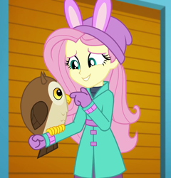 Size: 1035x1080 | Tagged: safe, screencap, character:fluttershy, species:bird, species:owl, equestria girls:holidays unwrapped, g4, my little pony:equestria girls, chad (owl), clothing, coat, cropped, cute, fluttershy's winter hat, hat, mittens, self-storage facility, shyabetes, smiling, winter break-in, winter coat, winter hat, winter outfit