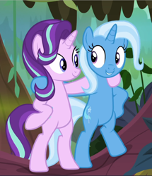 Size: 810x940 | Tagged: safe, screencap, character:starlight glimmer, character:trixie, species:pony, species:unicorn, episode:on the road to friendship, bipedal, cropped, duo, female, holding each other, hoof on hip, looking at each other, mare, smiling