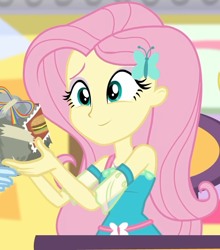 Size: 698x794 | Tagged: safe, screencap, character:fluttershy, character:rainbow dash, equestria girls:holidays unwrapped, g4, my little pony:equestria girls, bad gift wrapping, burger, canterlot mall, chair, clothing, cropped, cute, dashing through the mall, dress, female, flower, food, geode of fauna, gift giving, gift wrapped, hairclip, jewelry, magical geodes, mall, necklace, offscreen character, present, shyabetes, sitting, smiling, stamp, table, waistband