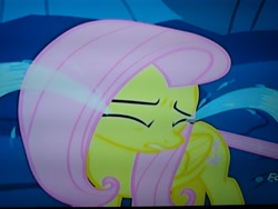 Size: 4160x3120 | Tagged: safe, screencap, character:fluttershy, species:changeling, species:pegasus, species:pony, episode:to where and back again, g4, my little pony: friendship is magic, closed wing, cropped, crying, discovery family logo, disguise, disguised changeling, eyes closed, feelings, frown, hurt/comfort, hurting, looking away, ocular gushers, photo, picture of a screen, sad, solo, stuck