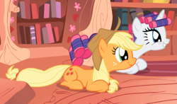 Size: 843x497 | Tagged: safe, screencap, character:applejack, character:rarity, character:twilight sparkle, character:twilight sparkle (unicorn), species:earth pony, species:pony, species:unicorn, episode:look before you sleep, g4, my little pony: friendship is magic, applejack's hat, clothing, cowboy hat, cropped, cute, duo, female, freckles, golden oaks library, hair curlers, hat, jackabetes, mare, prone, raribetes, smiling, wide eyes