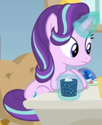 Size: 344x421 | Tagged: safe, screencap, character:starlight glimmer, species:pony, species:unicorn, episode:marks for effort, g4, my little pony: friendship is magic, chocolate, cropped, desk, empathy cocoa, food, glow, glowing cup, glowing horn, hooves on the table, horn, hot chocolate, looking at someone, marshmallows, sitting, solo, starlight's office
