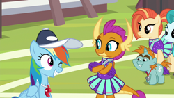 Size: 1920x1080 | Tagged: safe, screencap, character:lighthoof, character:rainbow dash, character:shimmy shake, character:smolder, character:snips, species:dragon, species:earth pony, species:pegasus, species:pony, species:unicorn, episode:2-4-6 greaaat, buckball field, bucktooth, cheerleader, cheerleader outfit, cheerleader smolder, clothing, coach rainbow dash, coaching cap, colt, crossed arms, cute, cute little fangs, dashabetes, dragoness, fangs, female, foal, folded wings, frown, grin, horns, looking at each other, male, mare, multicolored hair, one eye closed, pleated skirt, pom pom, ponytail, sitting, smiling, smolderbetes, teacher and student, teenaged dragon, teenager, whistle, whistle necklace, wink, young mare