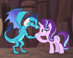 Size: 1123x886 | Tagged: safe, screencap, character:princess ember, character:starlight glimmer, species:dragon, species:pony, species:unicorn, episode:celestial advice, g4, my little pony: friendship is magic, cropped, dragoness, duo, female, handshake, holding hands, looking at each other, mare, muscles, predator (franchise), smiling