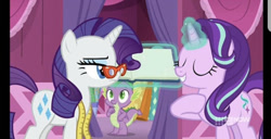 Size: 828x424 | Tagged: safe, screencap, character:rarity, character:spike, character:starlight glimmer, species:dragon, species:pony, species:unicorn, episode:a-dressing memories, 9now, book, eyes closed, female, glasses, levitation, magic, male, mare, measuring tape, nine network, rarity's glasses, telekinesis, unamused