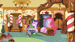 Size: 1600x900 | Tagged: safe, screencap, character:pinkie pie, character:spike, character:starlight glimmer, species:dragon, episode:cakes for the memories, book, candy, candy cane, ceiling light, chandelier, crossed hooves, display case, door, food, indoors, looking up, rug, scrapbook, sugarcube corner, vase, watermark, winged spike