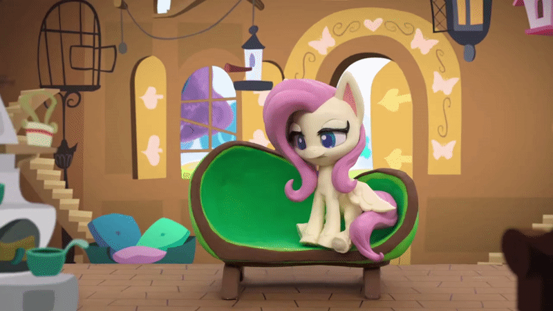 Size: 800x450 | Tagged: safe, screencap, character:fluttershy, species:pegasus, species:pony, g4.5, my little pony: stop motion short, my little pony:pony life, animated, bird feeder, blinking, butterfly, cage, chair, cute, eyes closed, fluttershy's cottage (interior), fluttershy's hiccups, gif, happy, hiccup, looking at something, pillow, sad, solo, stop motion, window