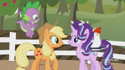 Size: 1280x720 | Tagged: safe, screencap, character:applejack, character:spike, character:starlight glimmer, species:bird, species:chicken, species:dragon, species:earth pony, species:pony, species:unicorn, episode:harvesting memories, apple, apple tree, bedroom eyes, book, female, flying, looking at each other, mare, sweet apple acres, sweet apple acres barn, tree