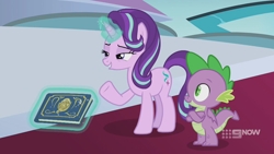 Size: 1280x720 | Tagged: safe, screencap, character:spike, character:starlight glimmer, species:dragon, species:pony, species:unicorn, episode:memories and more, 9now, book, crossed arms, duo, levitation, magic, magic aura, scrapbook, telekinesis, winged spike