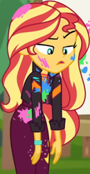 Size: 387x742 | Tagged: safe, screencap, character:sunset shimmer, equestria girls:sunset's backstage pass, g4, my little pony:equestria girls, belt, canvas, clothing, cropped, cute, female, forest background, geode of empathy, grass, jacket, jewelry, leather jacket, lidded eyes, long sleeves, looking down, magical geodes, music festival outfit, necklace, outdoors, paint, pants, raised eyebrow, shimmerbetes, shirt, unamused, wavy hair