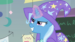 Size: 1920x1080 | Tagged: safe, screencap, character:trixie, species:pony, species:unicorn, episode:a horse shoe-in, g4, my little pony: friendship is magic, cape, clothing, female, grin, hat, magic, magic aura, mare, smiling, solo, trixie's cape, trixie's hat