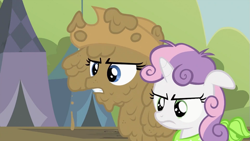Size: 993x559 | Tagged: safe, screencap, character:rarity, character:sweetie belle, species:earth pony, species:pony, species:unicorn, episode:sisterhooves social, g4, my little pony: friendship is magic, applejack's hat, clothing, covered in mud, cowboy hat, disguise, female, hat, implied applejack, mud, muddy, rarity is not amused, siblings, sisters, standing next to each other, sweetie belle is not amused, unamused